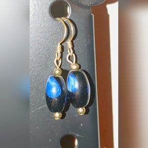 Blue, black, and gold earrings